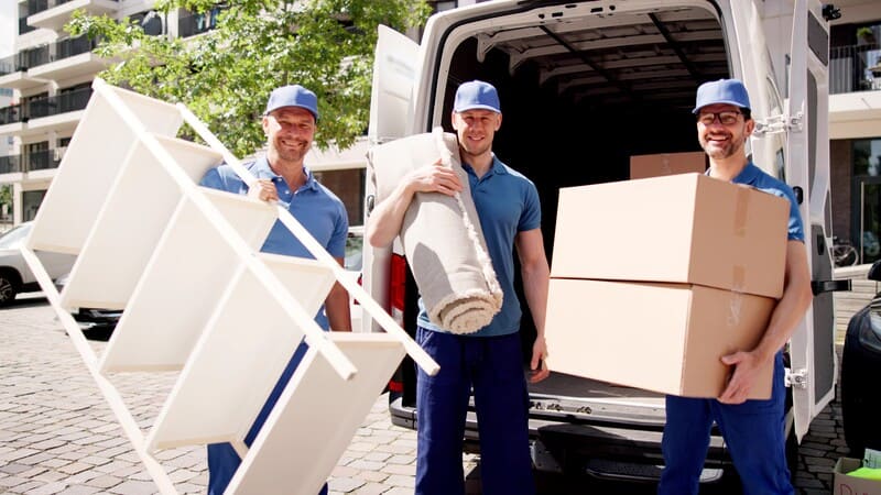 2 movers carry furniture
