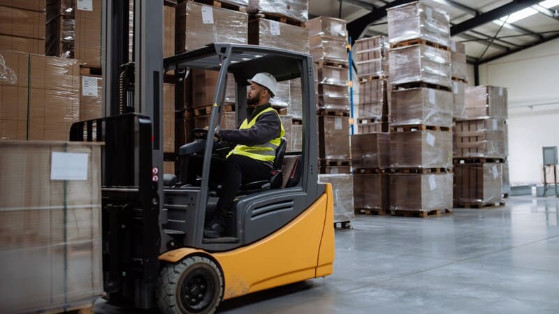 Forklift truck transports boxes