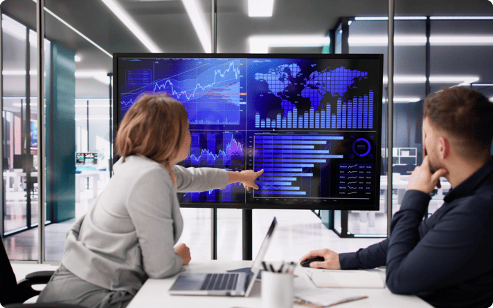 woman pointing at a dashboard